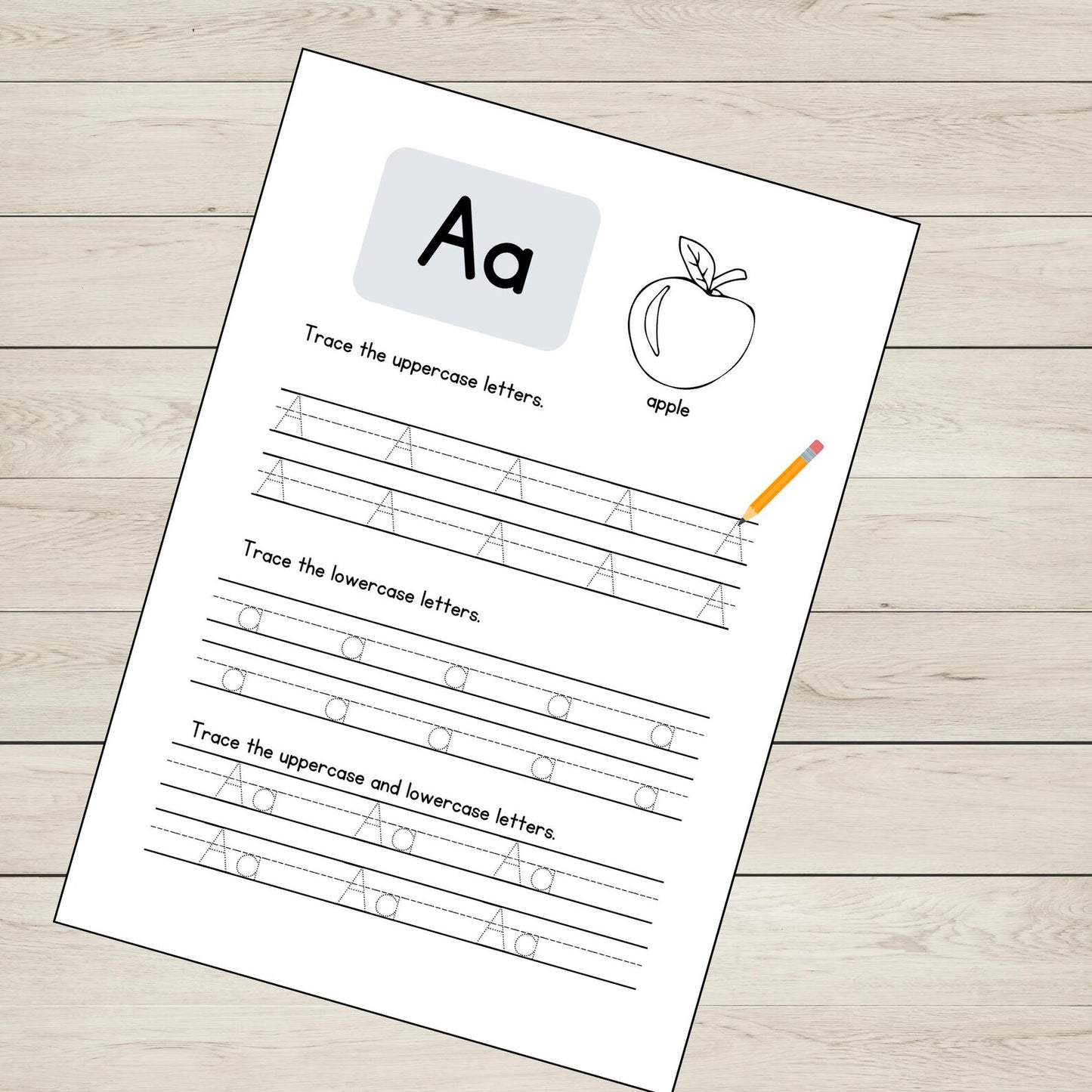 Educational worksheet for tracing uppercase and lowercase 'A's with an apple illustration on a wooden surface.