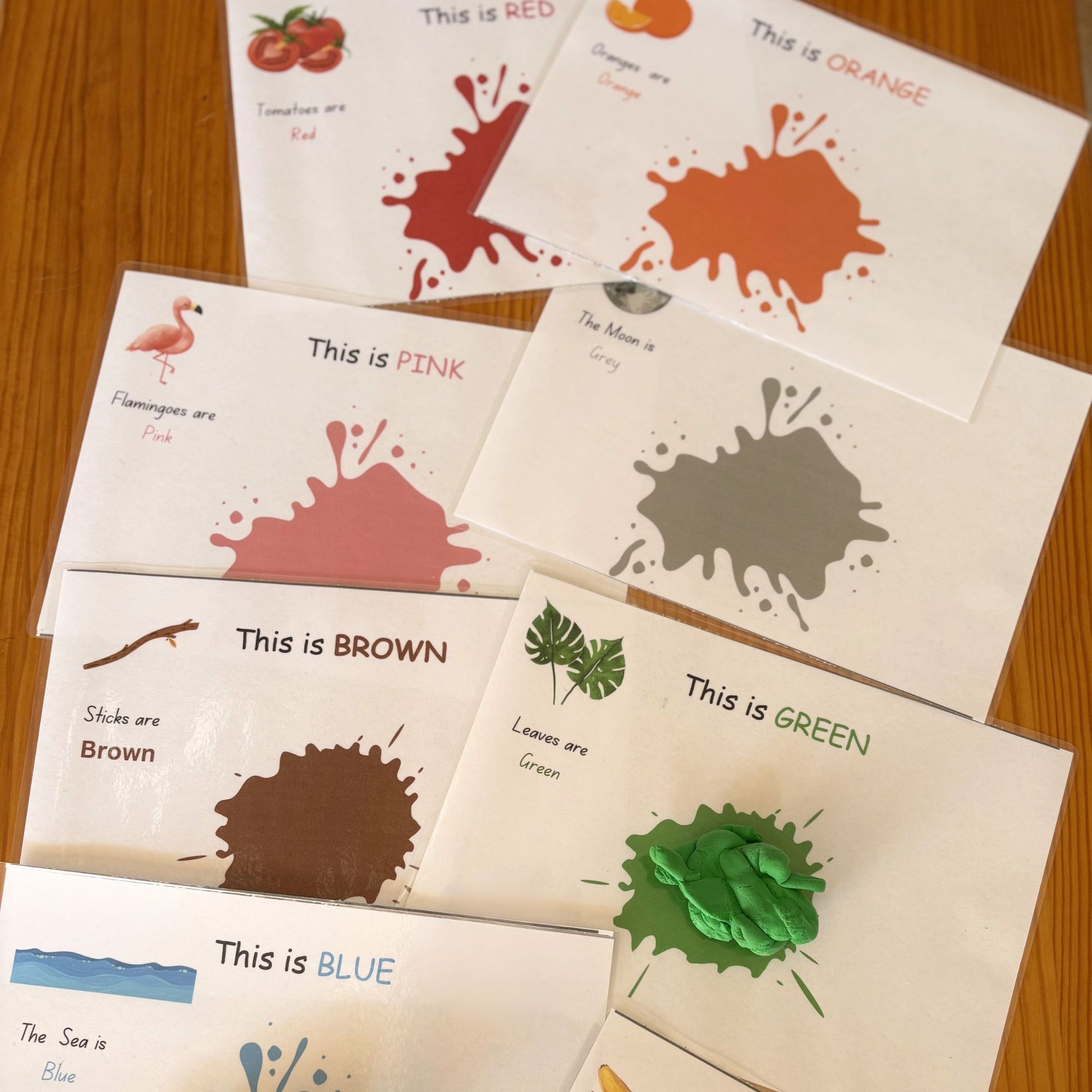 Educational cards teaching colours with colour splashes for use as playdough mats. 