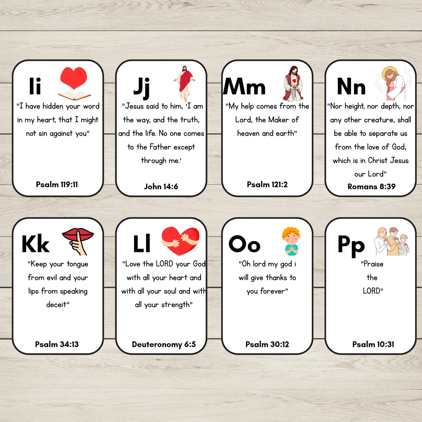 Eight small white Bible verse cards I to P, arranged in two rows on a light wood surface. Each card has a rounded rectangle shape, a black border, a letter at the top, a scripture quote, a small illustration, and the verse reference at the bottom.