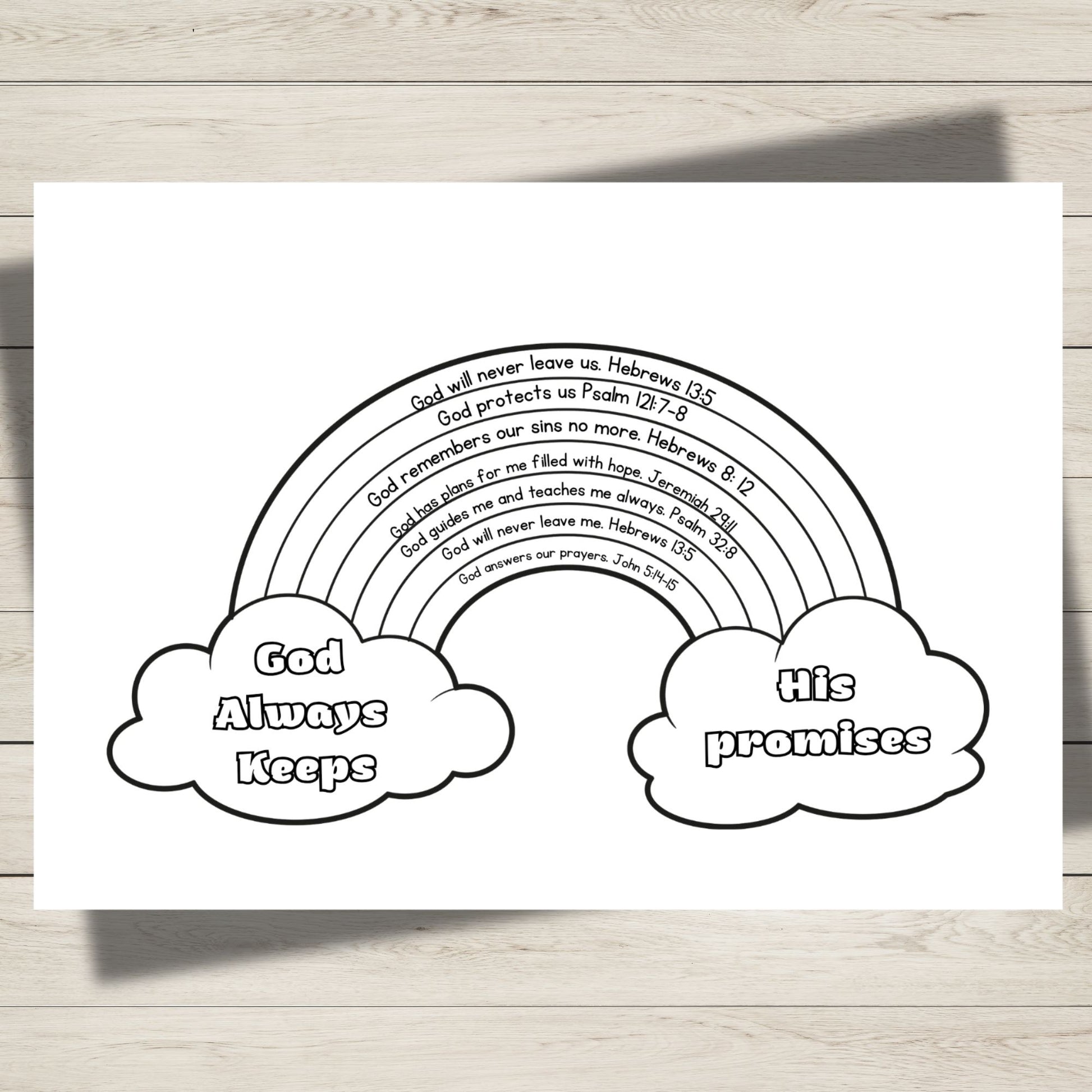 A black and white printable colouring page featuring a rainbow with Bible verses printed inside it, flanked by two clouds reading 'God Always Keeps' and 'His promises', shown on a light wood background.