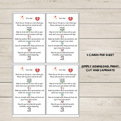 Four printed first day prayer cards with text on a wooden surface