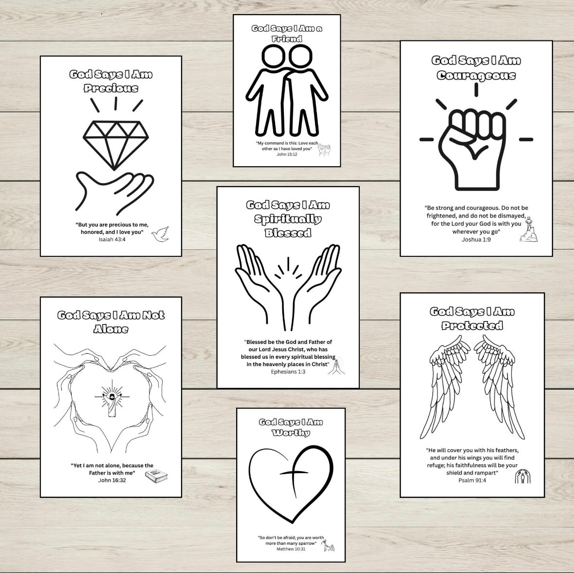 Set of colouring pages with motivational phrases and symbols on a wooden surface