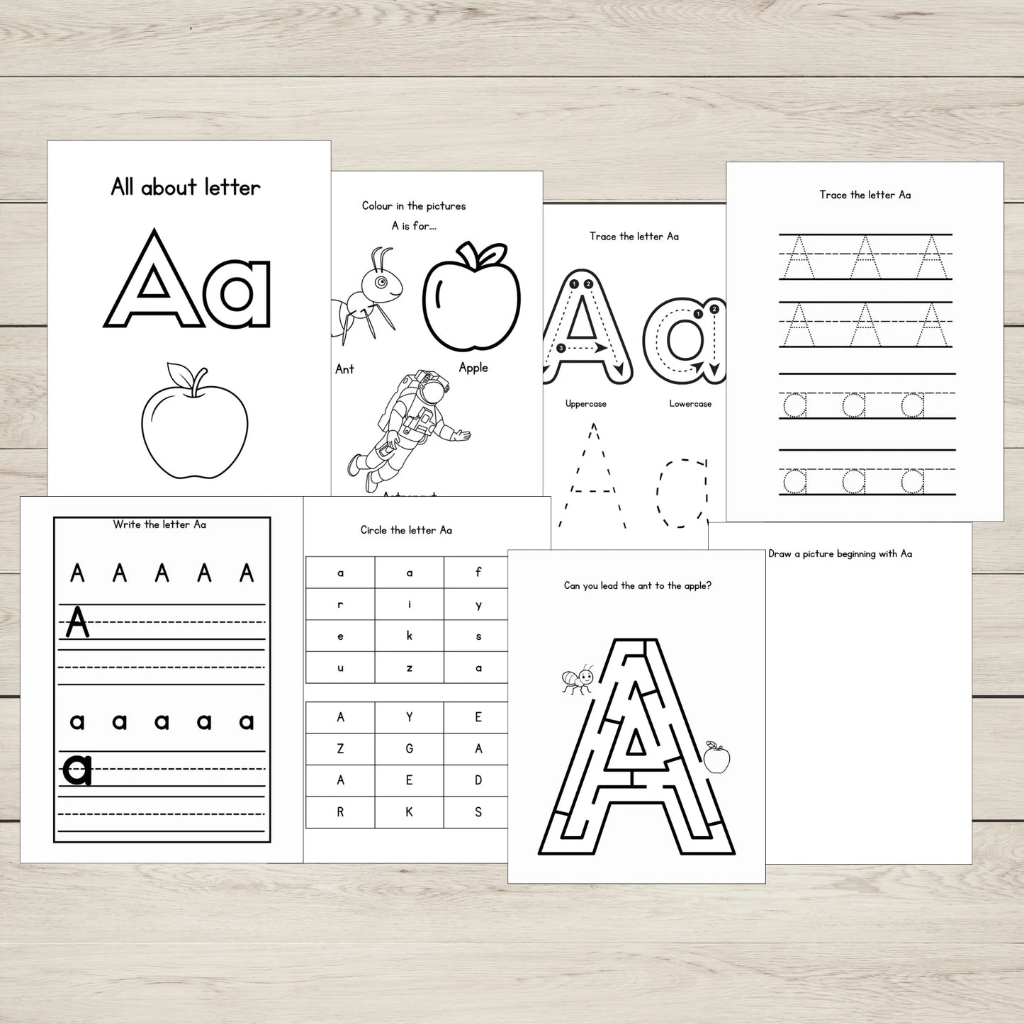 Set of educational worksheets focused on the letter 'A' on a wooden surface.