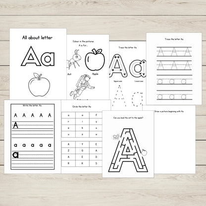 Set of educational worksheets focused on the letter 'A' on a wooden surface.