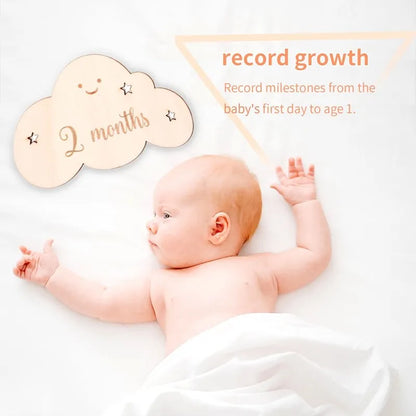 "A baby 2 month wooden cloud milestone cloud."