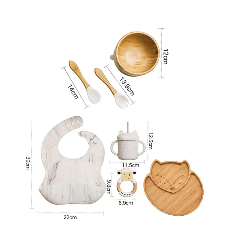 "A marble and bamboo bib, rattle, cup, spoon, fork, bowl, cat shaped plate for babies and toddlers."