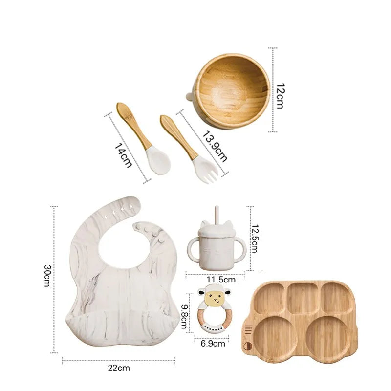 "A marble and bamboo bib, rattle, cup, spoon, fork, bowl, bus shaped plate for babies and toddlers." 