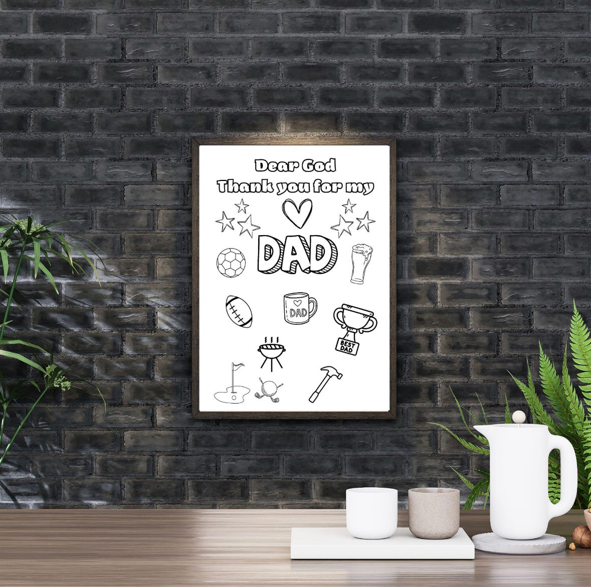 Framed print with 'Dear God, Thank you for my DAD' text and illustrations on a black brick wall.