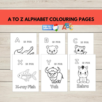 A to Z alphabet colouring pages with animal illustrations on a wooden surface.