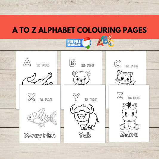 A to Z alphabet colouring pages with animal illustrations on a wooden surface.