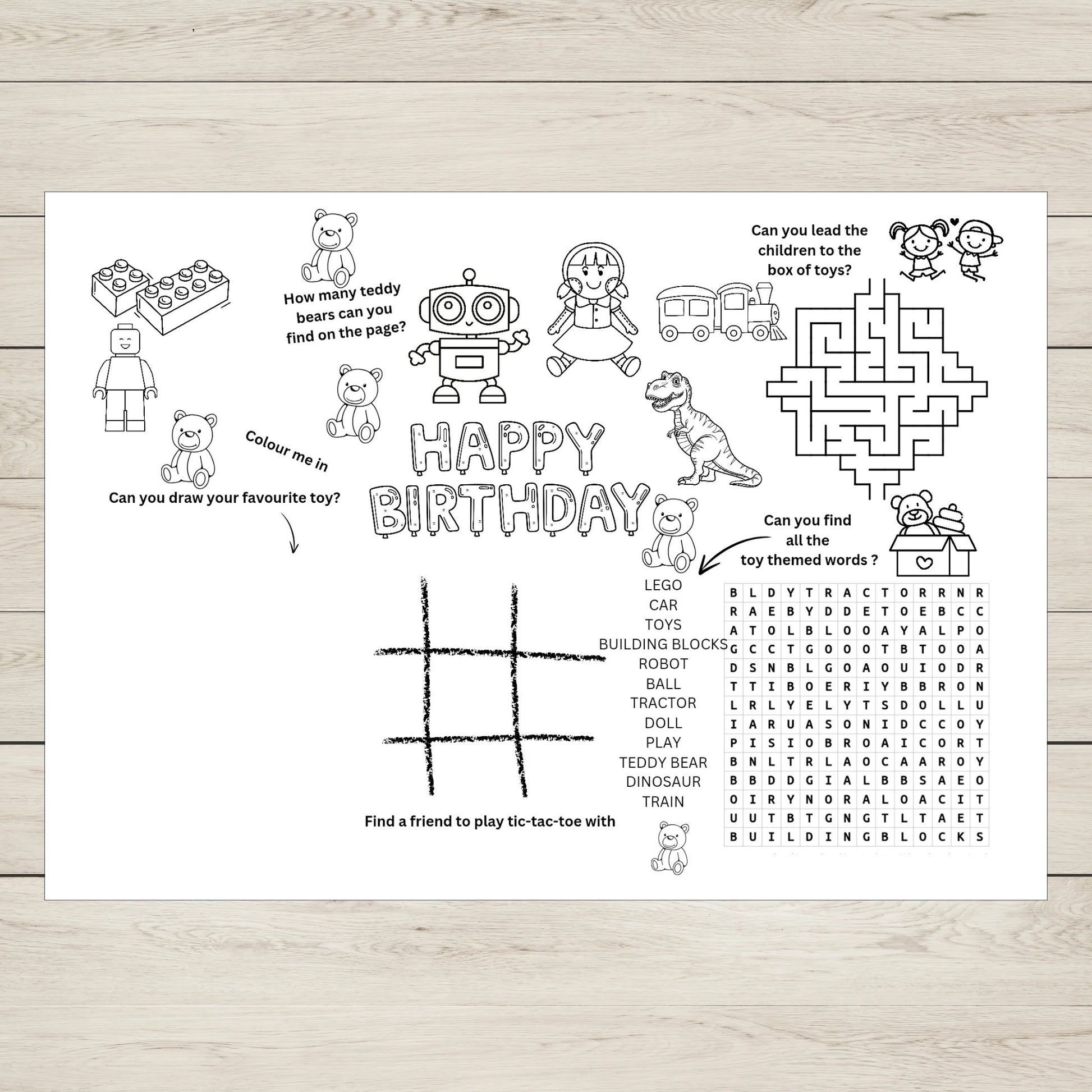 Children's birthday activity sheet with various games and colouring prompts on a wooden surface.