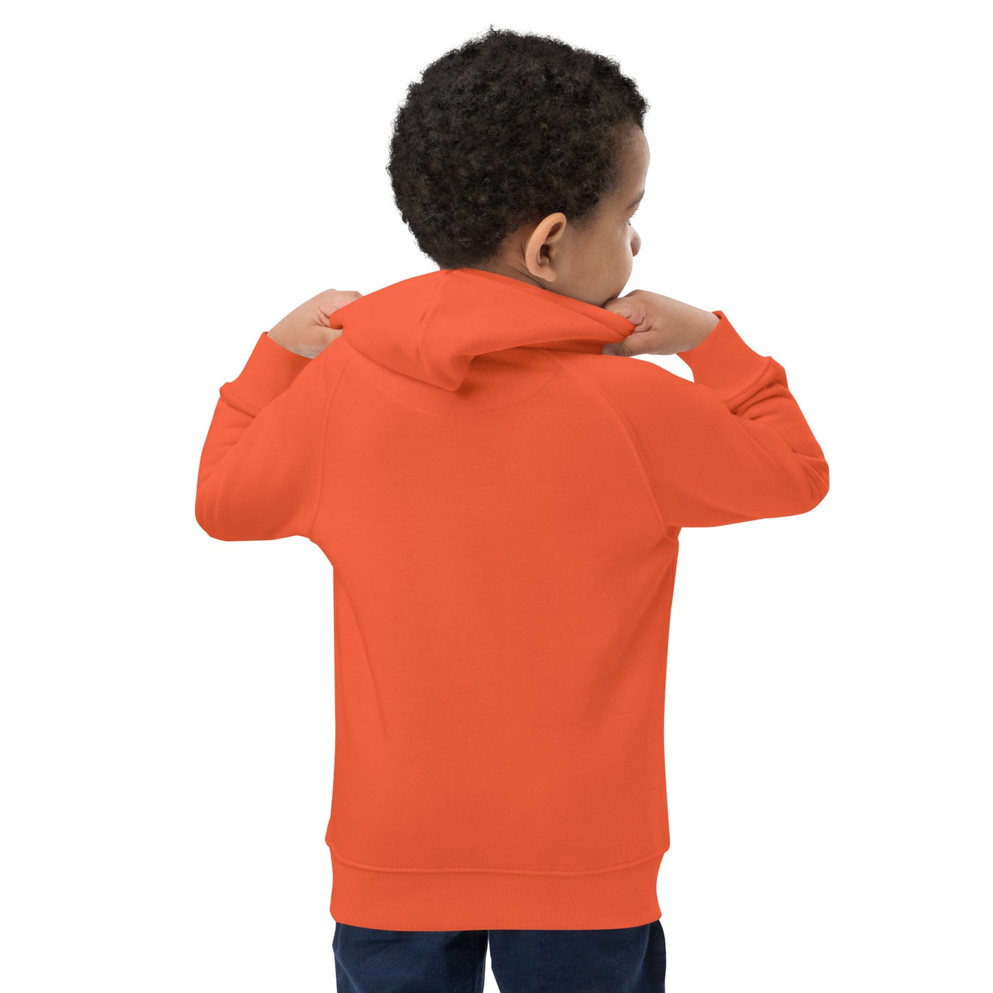 "A young boy wearing an orange hoodie with the back showing."