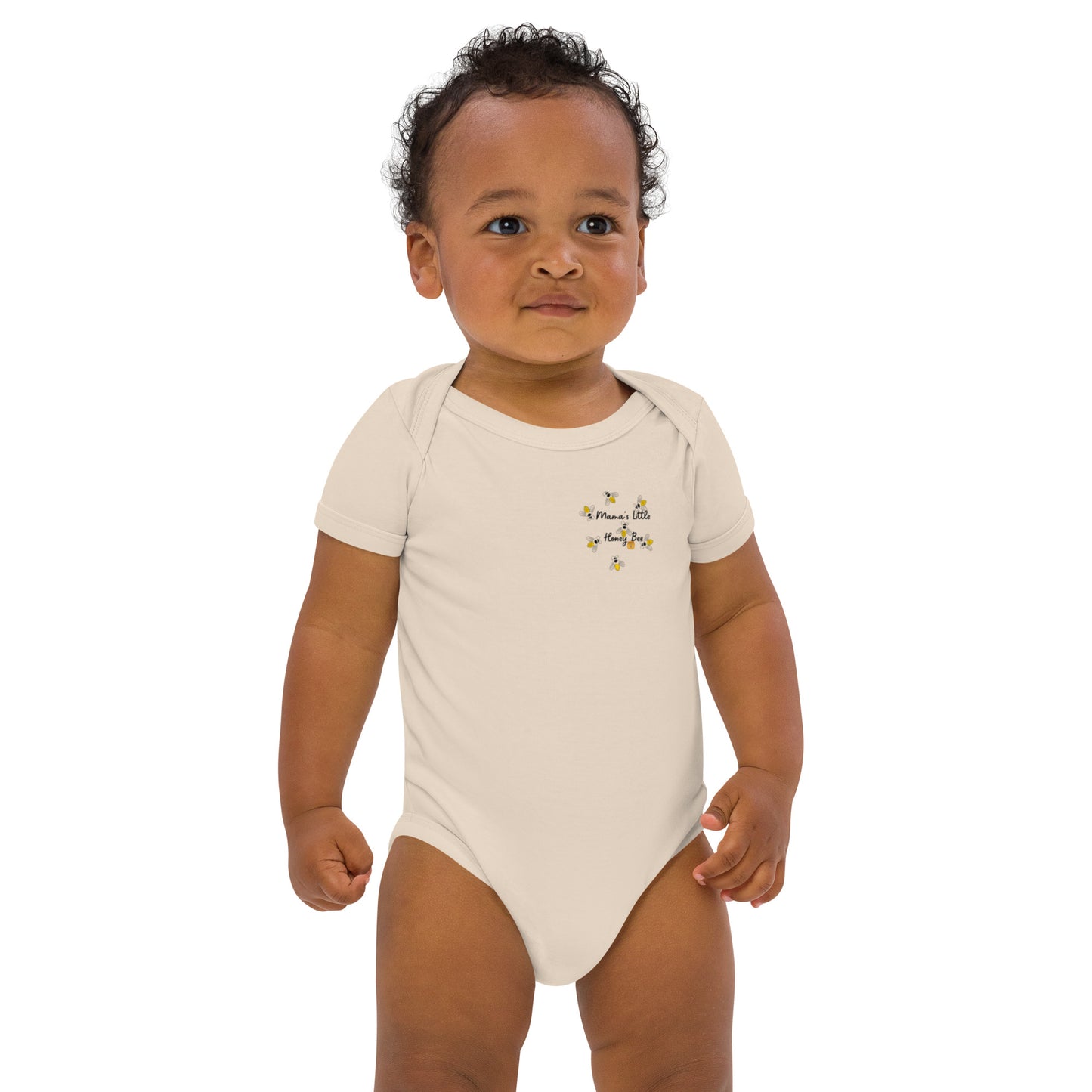 "A toddler boy wearing a neutral mamas little honey bee bodysuit."