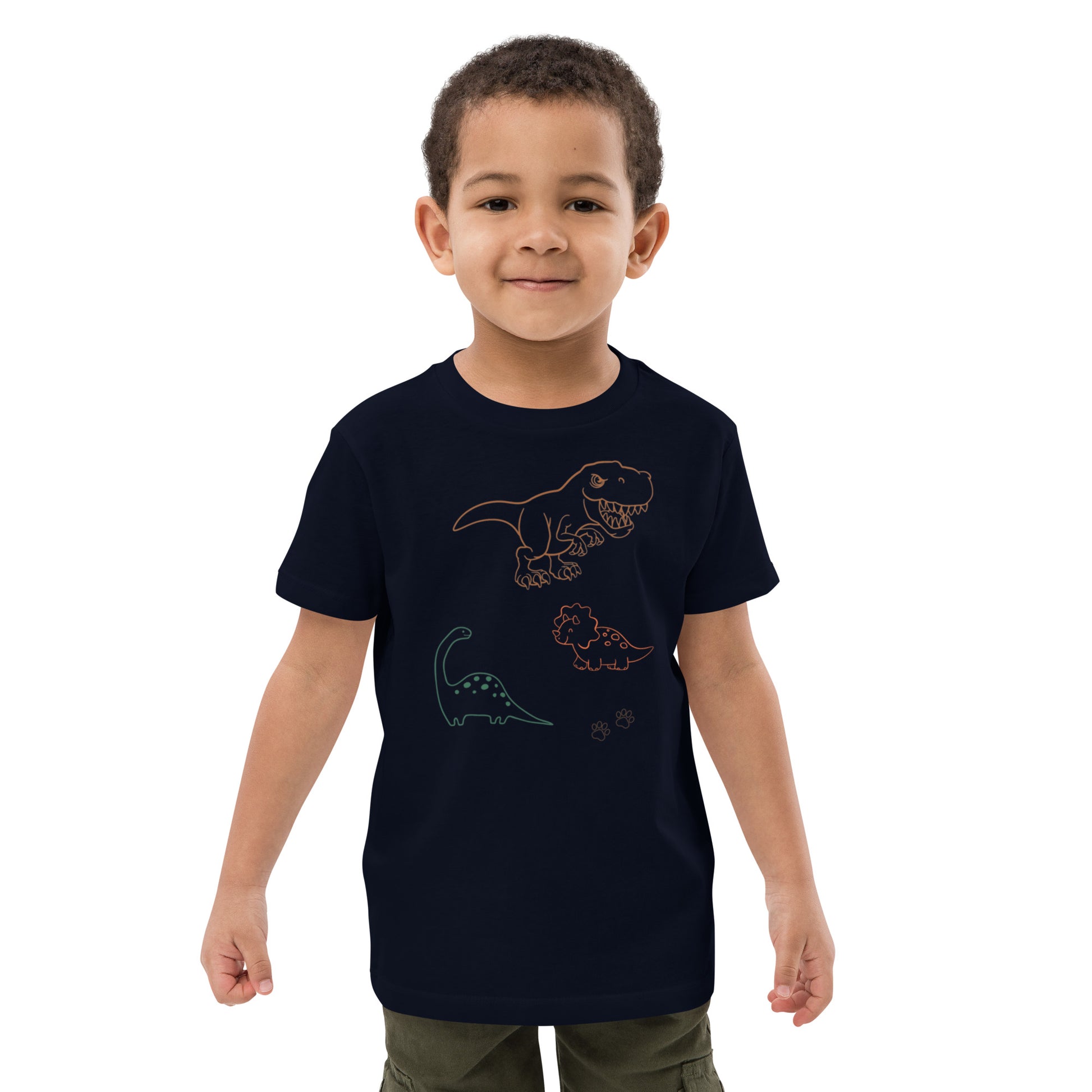 "A boy wearing a french navy dinosaur shirt."