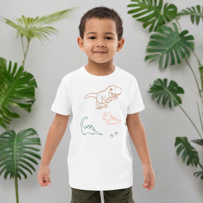 "A boy wearing a white dinosaur shirt."