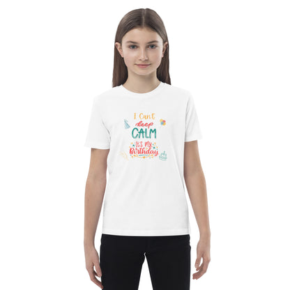 "A  small girl wearing a white I Can't Keep Calm It's my Birthday Slogan T-Shirt."