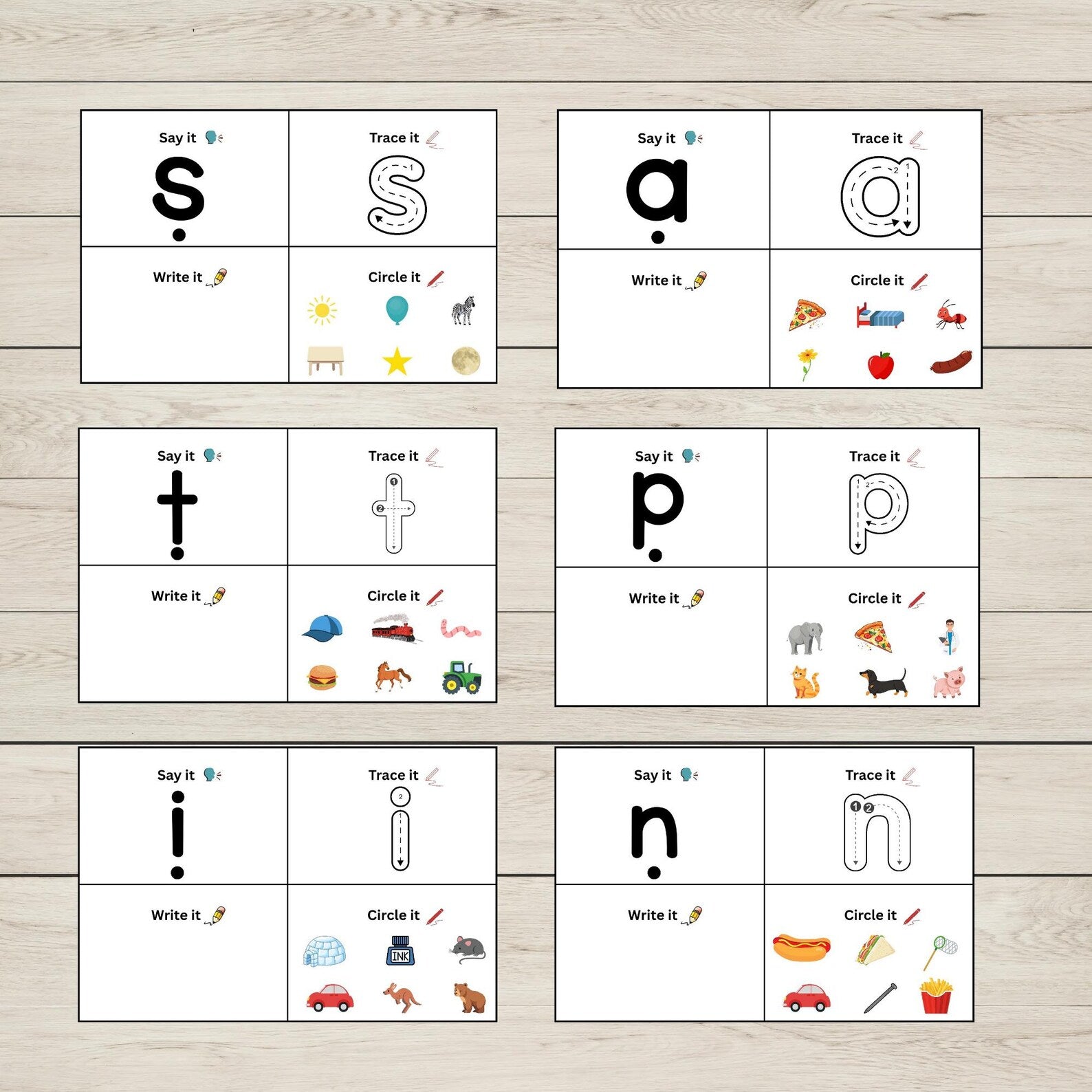 Educational activity boards with SATPIN sounds activities, and illustrations on a wooden surface.