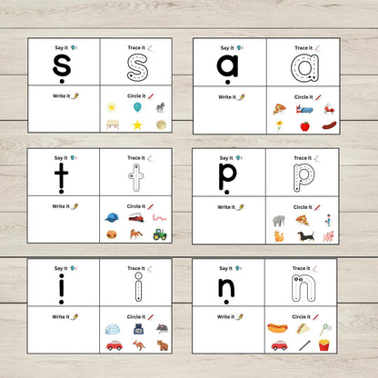 Educational activity boards with SATPIN sounds activities, and illustrations on a wooden surface.
