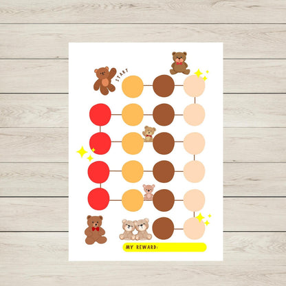 Reward chart with teddy bear illustrations on a wooden surface