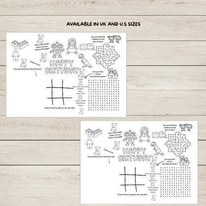 Two black and white birthday-themed activity sheets on a wooden surface.